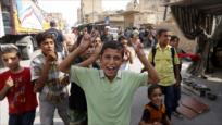 Sirios festejan llegada de un convoy humanitario iraní a Deir Ezzor