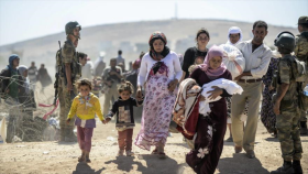 Cientos de habitantes de Kobani vuelven a su ciudad desde Turquía