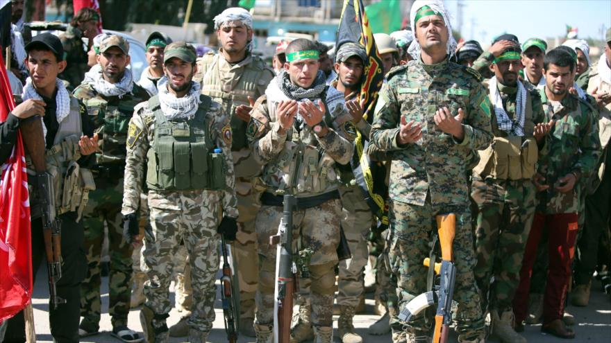 Fuerzas de seguridad iraquíes y los combatientes voluntarios chiíes en Samarra