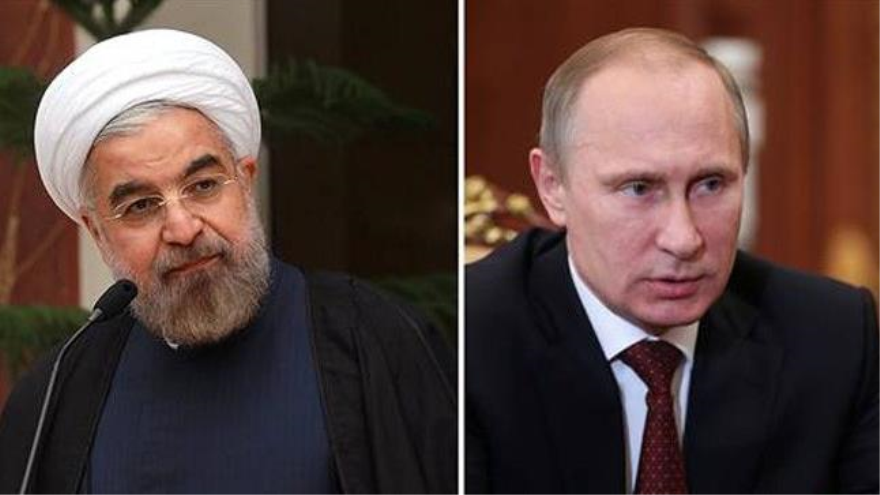 El presidente de Irán, Hasan Rohani, (izda) y su homólogo ruso, Vladimir Putin, (dcha)