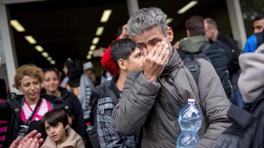Un refugiado llora mientras llega a la ciudad de Dortmund, en el oeste de Alemania. 6 de septiembre de 2015.