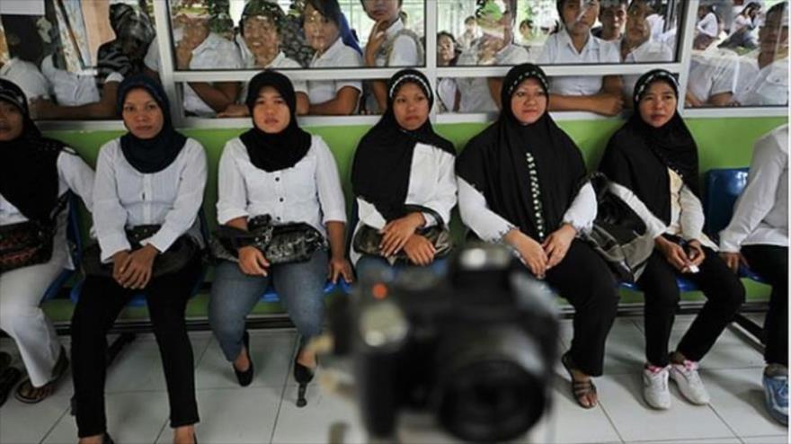 Algunas mujeres indonesias que viajan a Arabia Saudí como trabajadoras domesticas. 