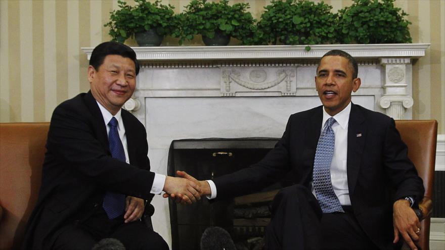 Presidente chino, Xi Jinping (izda) y su homólogo estadounidense, Barack Obama.