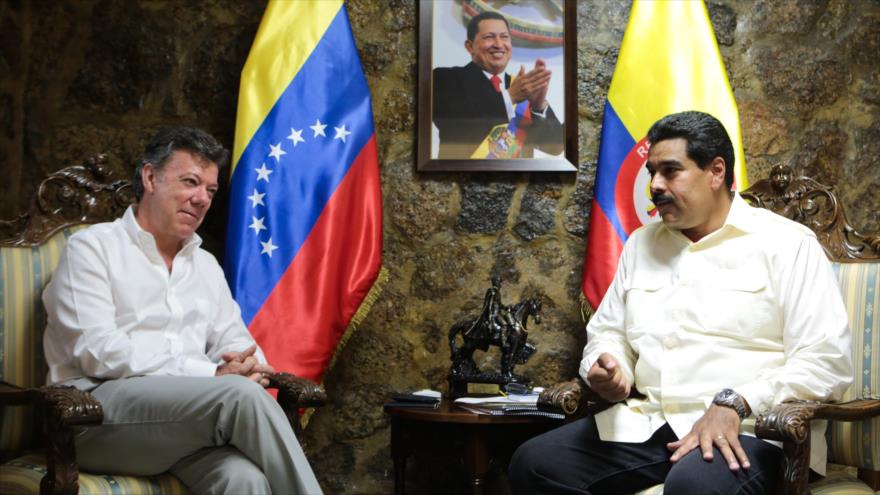 Presidente de Venezuela, Nicolás Maduro (dcha.), y su homólogo colombiano, Juan Manuel Santos.