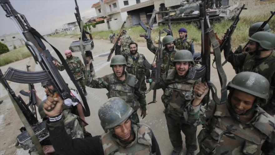 Fuerzas sirias celebran una de sus victorias ante los terroristas.