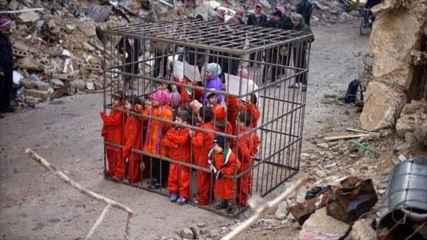 Integrantes del EIIL (Daesh en árabe) amenazan con quemar vivas mujeres y niños que tienen secuestrados.