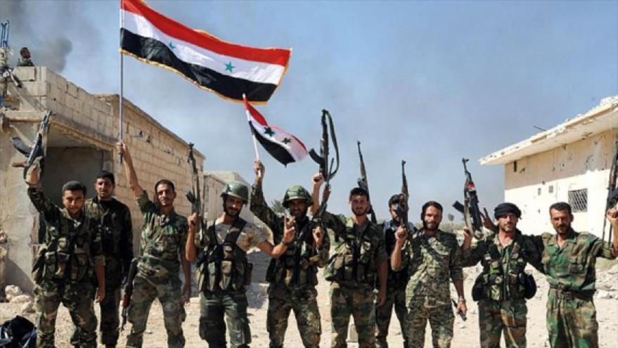 Fuerzas sirias festejan una de sus victorias contra los grupos terroristas que operan en Siria.