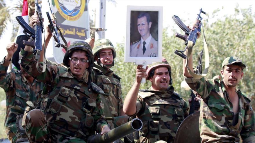 Soldados del Ejército sirio celebrando una de sus victorias.