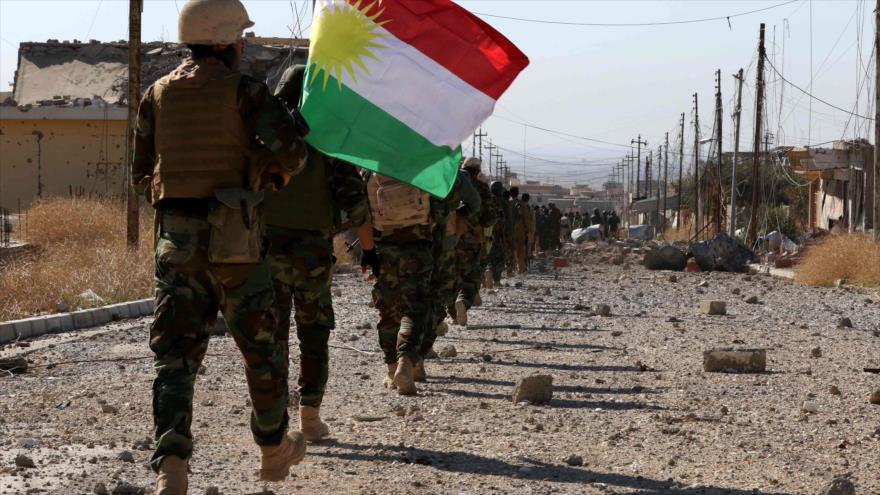 Fuerzas kurdas iraquíes (los Peshmerga) entran en la ciudad de Sinyar (norte).