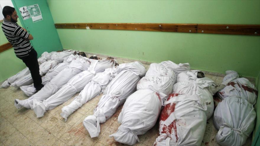 Unos palestinos muertos en los ataques israelíes contra la Franja de Gaza, 3 de agosto de 2014.