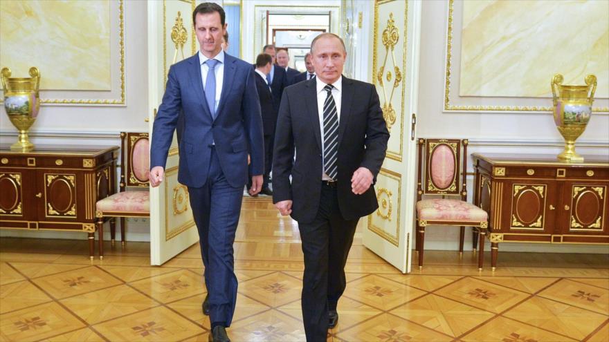 Presidente de Rusia, Vladimir Putin (dcha.), y su homólogo sirio, Bashar al-Asad.
