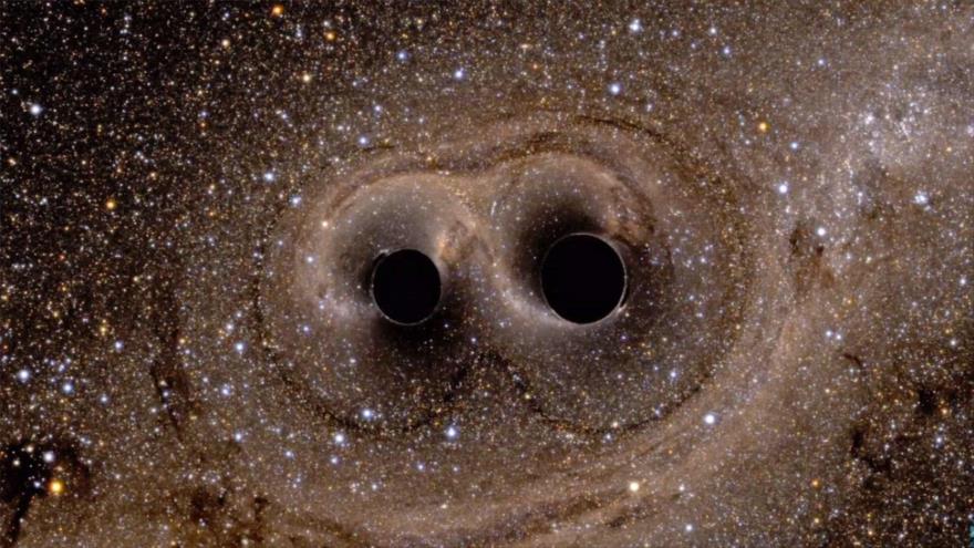 Recreación de dos agujeros negros a punto de fusionarse.