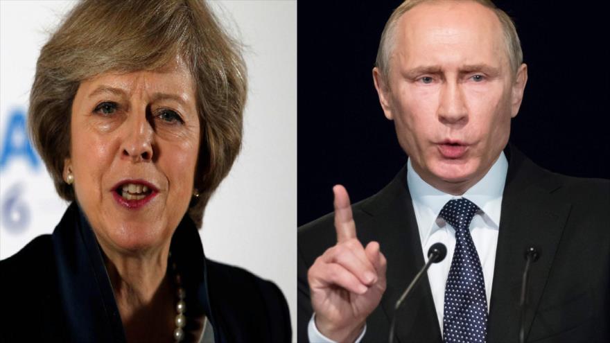 La primera ministra británica, Theresa May, y el presidente de Rusia, Vladimir Putin.