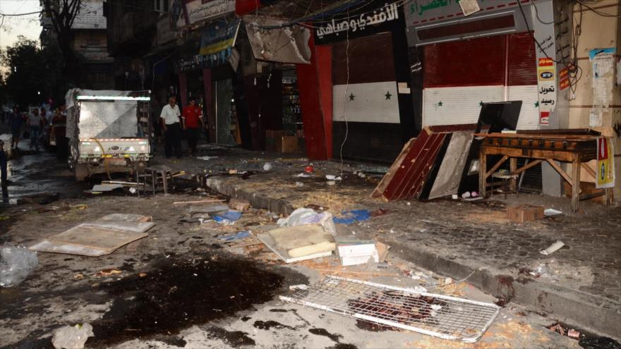 Destrucción causada por un bombardeo con artillería en el barrio Al-Jamiliyeh, una zona en Alepo bajo el control del Ejército sirio, 6 de octubre de 2016.