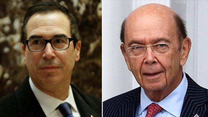El banquero Steven Mnuchin (izqda.) y el multimillonario empresario Wilbur Ross.