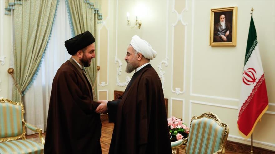 El presidente de Irán, Hasan Rohani (dcha.), se reúne con el presidente de la Asamblea Suprema Islámica de Irak, Seyed Amar al-Hakim, en Teherán, capital iraní, 13 de diciembre de 2016.