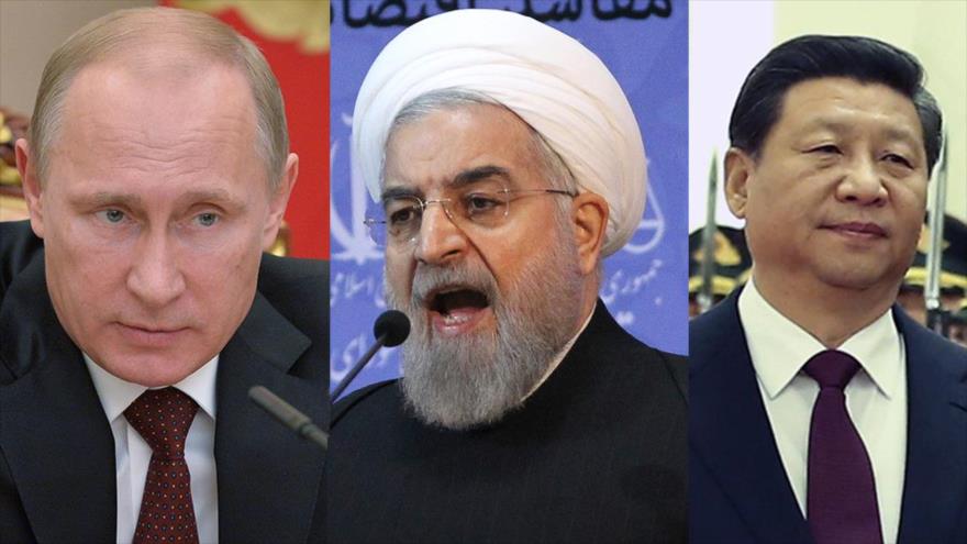 Los presidente de Rusia, China e Irán, Vladimir Putin (izda.), Hasan Rohani (centro), y Xi Jinping, respectivamente.