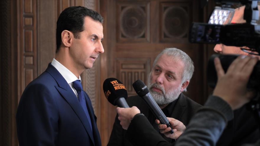 El presidente sirio, Bashar al-Asad, habla con periodistas belgas, 7 de febrero de 2017.
