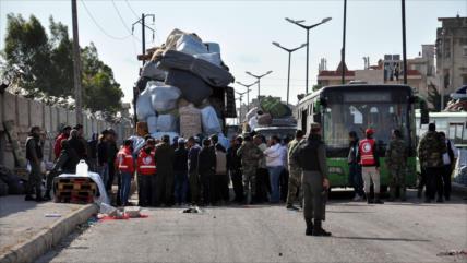 Rebeldes sirios evacúan su último feudo en Homs