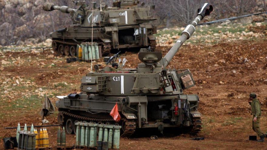 Cañones móviles de la artillería israelí estacionados en los ocupados altos de Gólan, cerca de la frontera con Siria.
