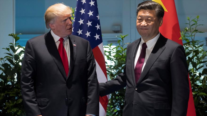 Los presidentes de China (dcha.) y EE.UU., Xi Jinping y Donald Trump, respectivamente, se reúnen en Pekín, 9 de noviembre de 2017.