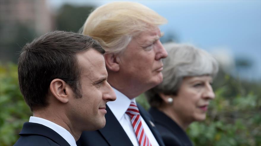 De izda a dcha: el presidente francés, Emmanuel Macron, el de EE.UU., Donald Trump y la premier británica, Theresa May, en Italia, 26 de mayo de 2017.