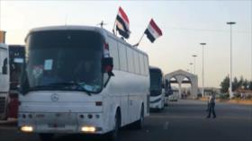 Centenares de civiles regresan a sus hogares cerca de Damasco