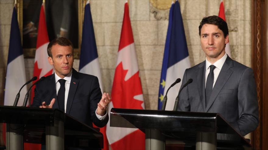 El presidente francés, Emmanuel Macron (izda.), en una rueda de prensa conjunta con el premier canadiense en Ottawa, Canadá, 7 de junio de 2018.