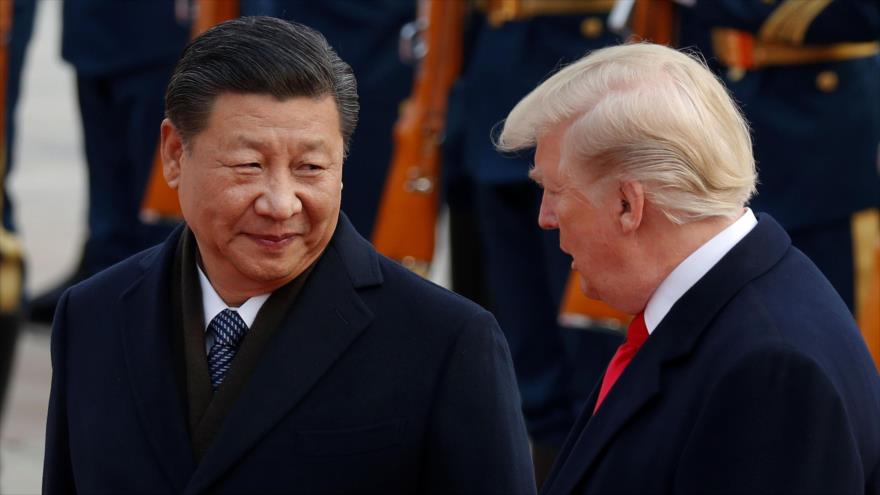 El presidente de China, Xi Jinping (izq.), y su par estadounidense, Donald Trump.