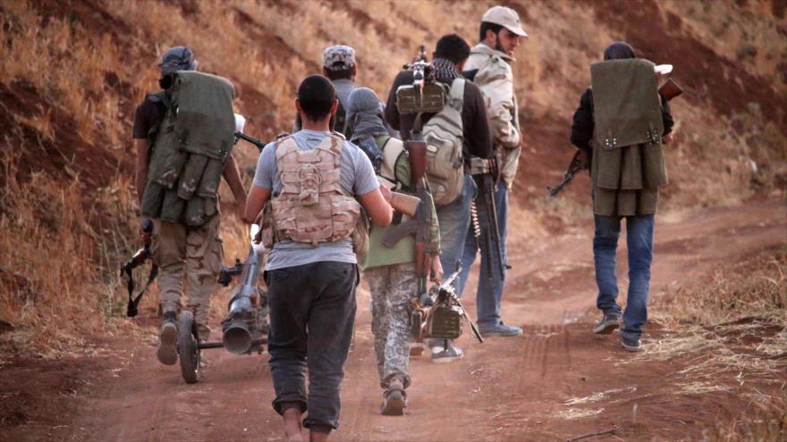 Miembros del Ejército Libre de Siria (ELS) desplegados en la ciudad de Daraa, 3 de julio de 2018.