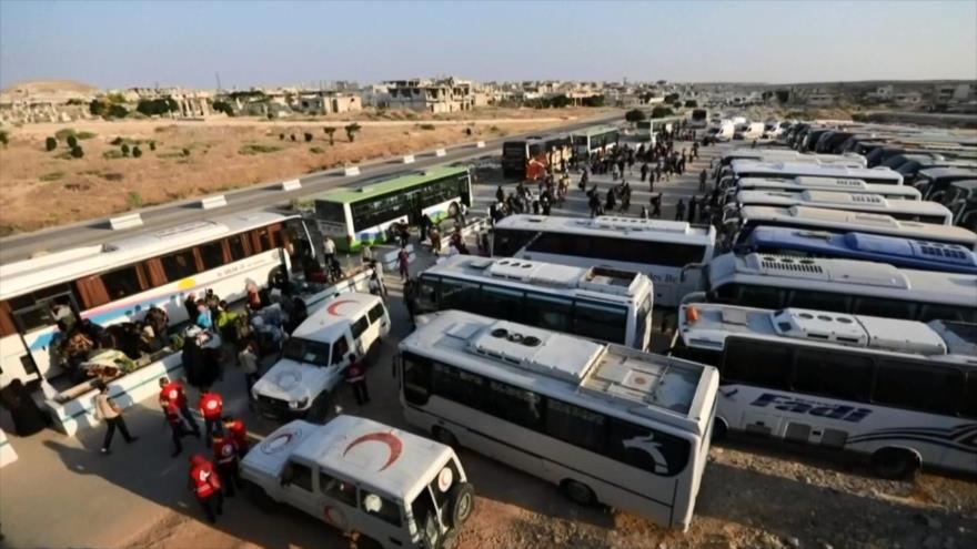 Cientos de rebeldes evacuan Al-Quneitra y Daraa en Siria