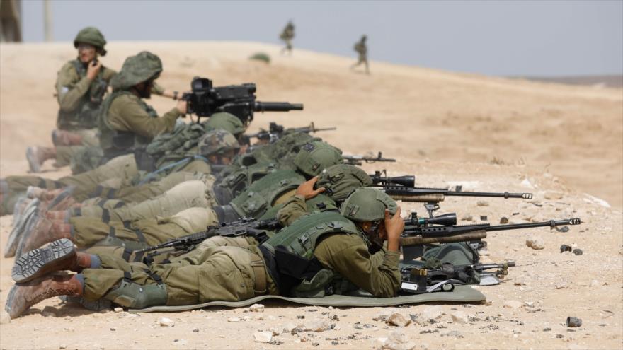Soldados israelíes durante un ejercicio militar en el que simulan un combate que tendría lugar en la Franja de Gaza, 3 de julio de 2018.