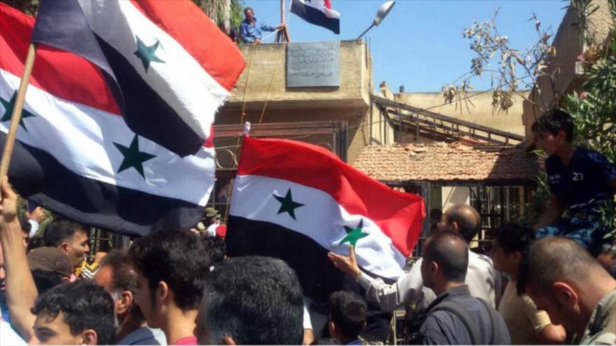 Vídeo: Ejército iza bandera siria en último feudo rebelde en Daraa