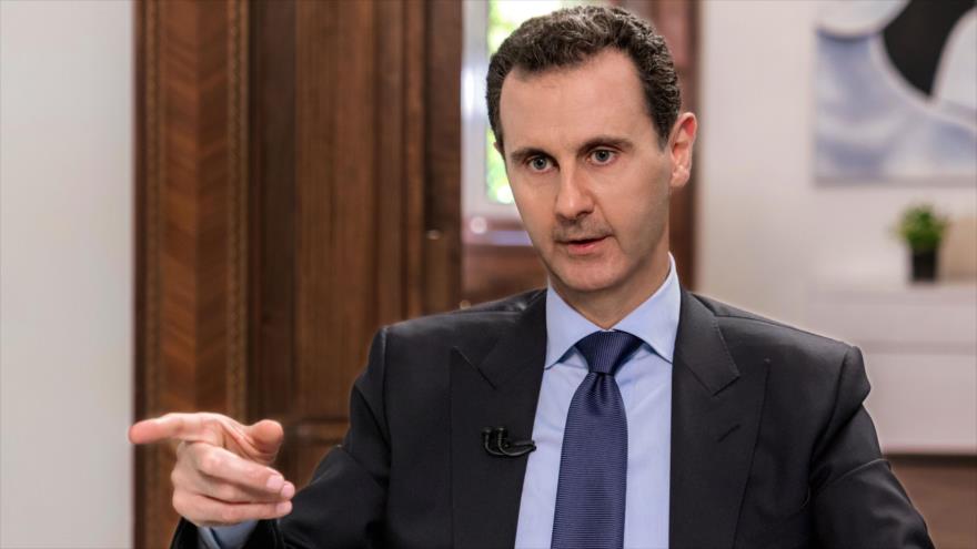 El presidente de Siria, Bashar al-Asad, habla durante una entrevista televisada con el canal ruso NTV en Damasco, 24 de junio de 2018. (Foto: AFP)