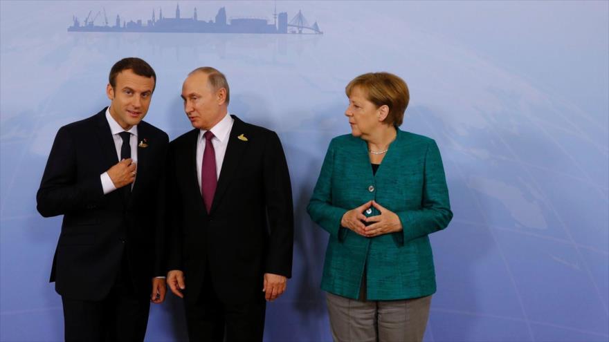 La canciller alemana y los presidentes de Francia (izda.) y Rusia en Hamburgo (Alemania), 8 de julio de 2017. (Foto: AFP)