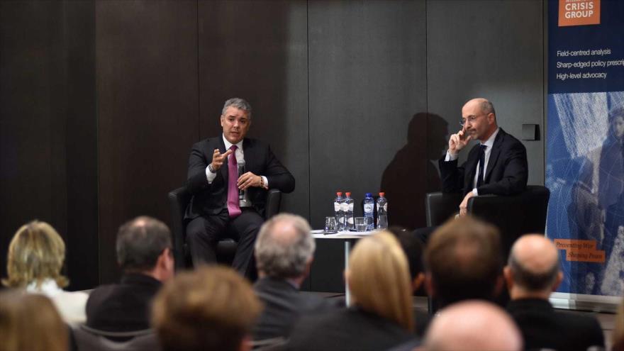 El mandatario de Colombia, Iván Duque (izq.), en un encuentro con el presidente del ICGI, Robert Maylle, Bruselas, 23 de octubre de 2018.