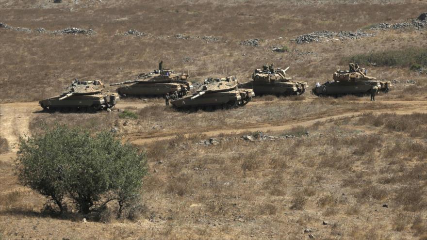 Tanques israelíes en los ocupados altos del Golán, 7 de agosto de 2018. (Foto: AFP)