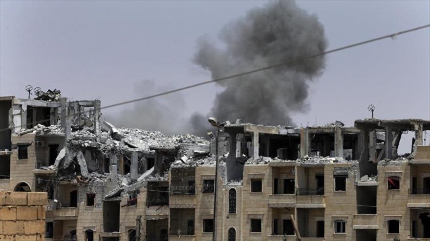 Edificios destruidos por un ataque de la llamada coalición anti-EIIL, liderada por EE.UU., en el norte de Siria.