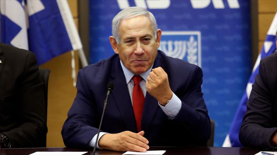 El primer ministro israelí, Benjamín Netanyahu (C), ofrece un discurso en el parlamento en Al-Quds (Jerusalén), 24 de diciembre de 2018. (Foto: AFP)