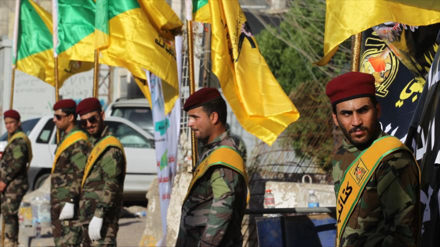 Los miembros de las Brigadas iraquíes de Hezbolá en una ceremonia en Bagdad (capital de Irak), 21 de junio de 2018. (Foto: AFP)