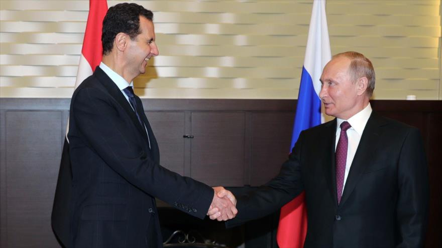 El presidente ruso, Vladimir Putin, reunido con su homólogo sirio, Bashar al-Asad, en Sochi (Rusia), 17 de mayo de 2018. (Foto: AFP)