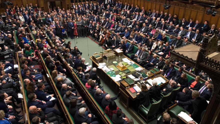 La premier británica, Theresa May, habla en la reunión del Parlamento para abordar el acuerdo del Brexit, London, 15 de enero de 2019. (Foto: AFP)