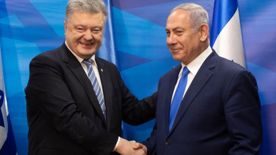 El primer ministro israelí, Benjamín Netanyahu (dcha.), y el presidente de Ucrania, Petro Poroshenko, en los terrotorios ocupados palestinos, 21 de enero de 2019. (Fuente: AFP)