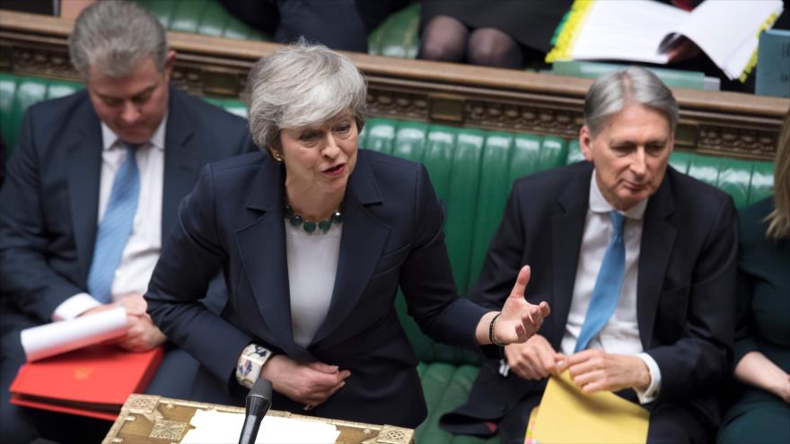 La primera ministra británica, Theresa May (centro), durante la votación en el Parlamento sobre el Brexit, 13 de marzo de 2019. (Fuente: AFP)