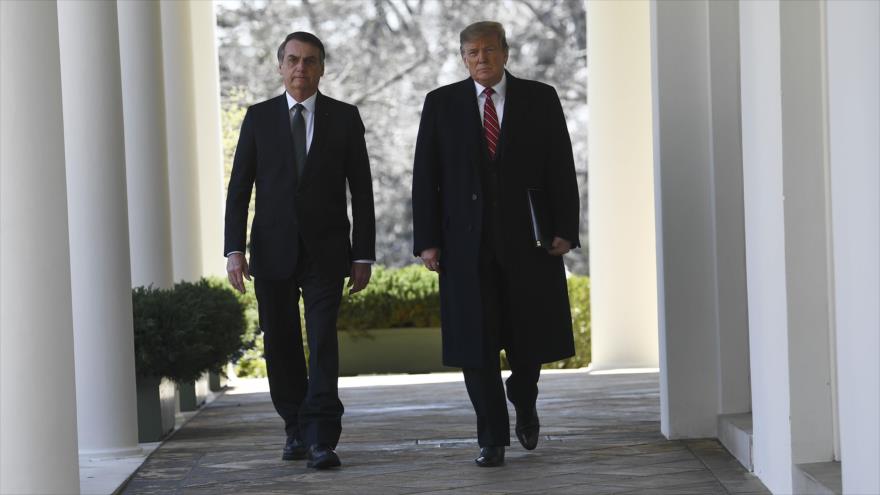 El presidente de EE.UU., Donald Trump (dcha.), y su par de Brasil, Jair Bolsonaro, en la Casa Blanca, 19 de marzo de 2019. (Foto: AFP)
