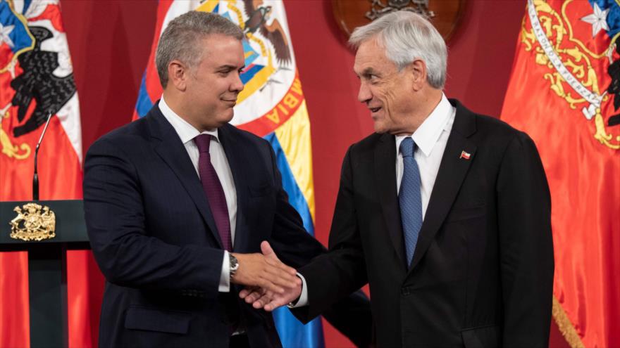 Los presidentes de Chile y Colombia, Sebastián Piñera (dcha.) e Iván Duque, respectivamente, Santiago, 21 de marzo de 2019. (Foto: AFP)