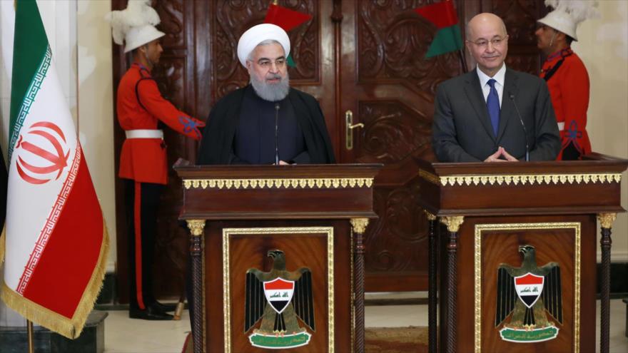 El presidente iraní, Hasan Rohani (izda.), y su par iraquí, Barham Salih, en una conferencia de prensa en Bagdad, 11 de marzo de 2019. (Foto: president.ir)