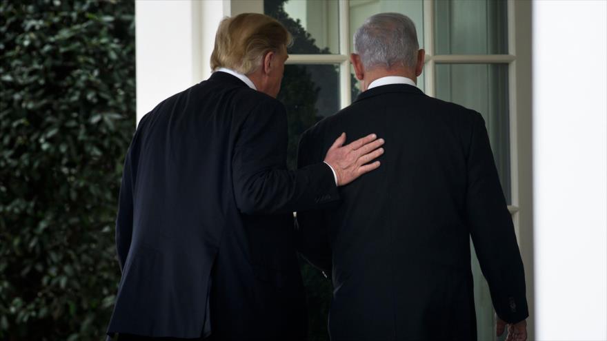El primer ministro de Israel, Benjamín Netanyahu (dcha.), junto con el presidente estadounidense, Donald Trump, en la Casa Blanca, 25 de marzo de 2019. (Foto: AFP)