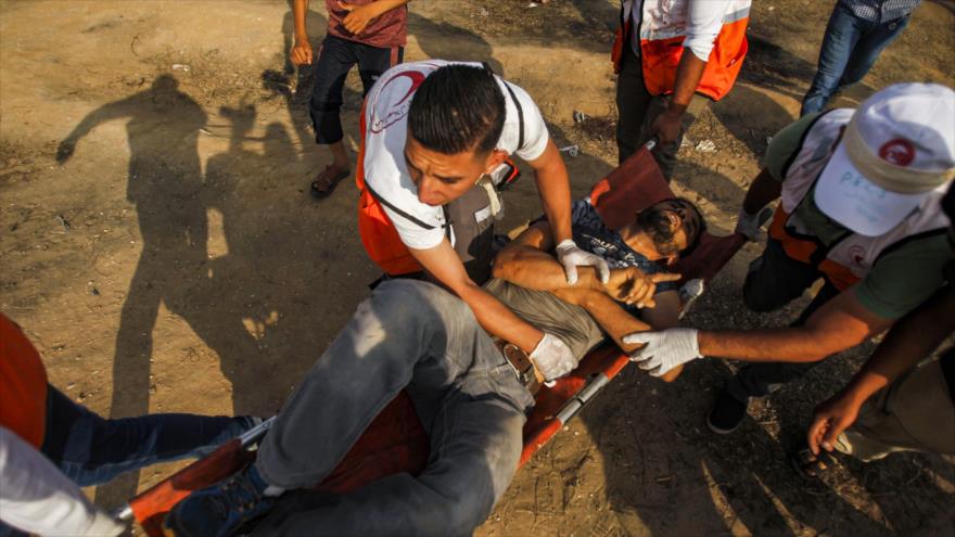 Un manifestante herido durante los enfrentamientos con las fuerzas israelíes, Franja de Gaza, 28 de junio de 2019. (Fuente: AFP)