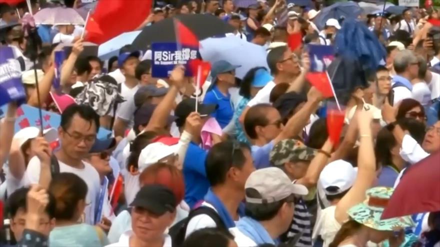 Miles se manifiestan en apoyo a la Policía en Hong Kong | HISPANTV